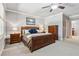 Bedroom featuring gray walls, white trim, natural light, and furnishings with a wooden frame bed at 1227 Magnolia Path Way, Sugar Hill, GA 30518
