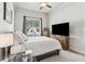 Bright bedroom with comfortable queen bed, window and furnishings at 1227 Magnolia Path Way, Sugar Hill, GA 30518