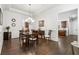 Formal dining room featuring hardwood floors, wainscoting, and an elegant chandelier at 1227 Magnolia Path Way, Sugar Hill, GA 30518