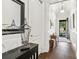 Inviting foyer with dark hardwood floors, white trim, and a view to the entry door at 1227 Magnolia Path Way, Sugar Hill, GA 30518