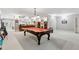 Spacious game room with a pool table, carpeted flooring, and neutral paint at 1227 Magnolia Path Way, Sugar Hill, GA 30518
