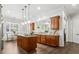 Spacious kitchen featuring an island, wooden cabinets, granite countertops, and stainless steel appliances at 1227 Magnolia Path Way, Sugar Hill, GA 30518
