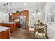 Breakfast nook adjacent to kitchen features a window and table with chairs at 1227 Magnolia Path Way, Sugar Hill, GA 30518