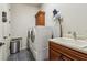 Functional laundry room with modern washer, dryer, utility sink, and ample storage at 1227 Magnolia Path Way, Sugar Hill, GA 30518