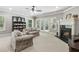 Basement living room featuring a fireplace and access to the backyard at 1227 Magnolia Path Way, Sugar Hill, GA 30518
