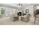 Cozy basement living room with fireplace, comfortable armchairs, and neutral decor at 1227 Magnolia Path Way, Sugar Hill, GA 30518