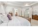 Spacious main bedroom with access to walk-in closets and ensuite bath at 1227 Magnolia Path Way, Sugar Hill, GA 30518