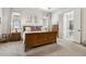Main bedroom with wood furniture, neutral walls and ensuite bath access at 1227 Magnolia Path Way, Sugar Hill, GA 30518