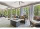 Outdoor patio space featuring a fire pit, comfortable seating, and views of the lush surroundings at 1227 Magnolia Path Way, Sugar Hill, GA 30518