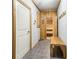 Relaxing sauna featuring wood paneling, stone flooring, and a comfortable wooden bench at 1227 Magnolia Path Way, Sugar Hill, GA 30518