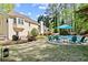 Inviting backyard pool area with seating, patio, and lush landscaping perfect for outdoor entertaining at 1315 Pembridge Nw Way, Kennesaw, GA 30152