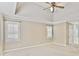Spacious bedroom with tray ceilings, carpeting, and natural light from windows at 1315 Pembridge Nw Way, Kennesaw, GA 30152