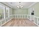 Dining room with elegant chandelier and wainscoting at 1315 Pembridge Nw Way, Kennesaw, GA 30152