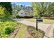 Landscaped front yard and long driveway to a charming, traditional home at 1315 Pembridge Nw Way, Kennesaw, GA 30152