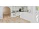 Kitchen area adjacent to dining area and featuring white cabinets at 1315 Pembridge Nw Way, Kennesaw, GA 30152