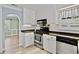 Kitchen featuring stainless steel appliances, white cabinets, and stone countertops at 1315 Pembridge Nw Way, Kennesaw, GA 30152