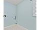 Clean and functional laundry area with tile flooring, essential hookups, and natural light from the window at 1315 Pembridge Nw Way, Kennesaw, GA 30152