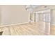 Open-concept living area with hardwood floors and natural light at 1315 Pembridge Nw Way, Kennesaw, GA 30152