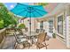 Charming outdoor deck offers a shady retreat with dining set, access to the backyard, and serene views at 1315 Pembridge Nw Way, Kennesaw, GA 30152