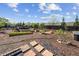 Backyard with lush landscaping and walkways featuring garden beds and a variety of plants and vegetables at 4241 Woodward Walk Ln, Suwanee, GA 30024