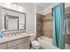 This bathroom features granite counters, tile flooring, and a tub/shower combo at 4241 Woodward Walk Ln, Suwanee, GA 30024