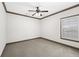 This bedroom features neutral carpeting and a ceiling fan at 4241 Woodward Walk Ln, Suwanee, GA 30024