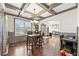 Charming dining space with hardwood floors, trim, and abundant natural light at 4241 Woodward Walk Ln, Suwanee, GA 30024
