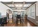Elegant dining area with decorative trim, hardwood floors, and stylish lighting at 4241 Woodward Walk Ln, Suwanee, GA 30024