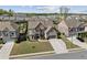 Beautiful two-story home featuring manicured landscaping and a three-car garage at 4241 Woodward Walk Ln, Suwanee, GA 30024