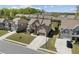 Beautiful two-story home with manicured landscaping, stone accents, and a spacious driveway at 4241 Woodward Walk Ln, Suwanee, GA 30024