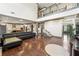 Expansive living room featuring soaring ceilings, hardwood floors and open concept to kitchen at 4241 Woodward Walk Ln, Suwanee, GA 30024