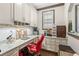 Office area with custom cabinetry, granite countertops and ample storage at 4241 Woodward Walk Ln, Suwanee, GA 30024