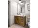 Charming bathroom featuring a wooden vanity with marble top and modern fixtures at 480 John Wesley Dobbs Ne Ave # 716, Atlanta, GA 30312