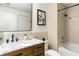 Stylish bathroom with a tiled shower, a marble vanity top, and modern fixtures at 480 John Wesley Dobbs Ne Ave # 716, Atlanta, GA 30312