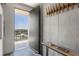 Apartment entryway with an open door to the balcony featuring a modern coat rack and decor at 480 John Wesley Dobbs Ne Ave # 716, Atlanta, GA 30312