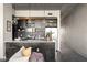 Contemporary kitchen with dark cabinets, pendant lighting, and an island with bar seating at 480 John Wesley Dobbs Ne Ave # 716, Atlanta, GA 30312