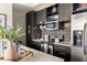 Modern kitchen featuring dark cabinets, stainless appliances, and a subway tile backsplash at 480 John Wesley Dobbs Ne Ave # 716, Atlanta, GA 30312
