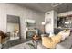 Stylish living room featuring modern furnishings, concrete walls, and an open layout at 480 John Wesley Dobbs Ne Ave # 716, Atlanta, GA 30312