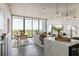 Open concept living space featuring city views, dining area, and modern lighting fixtures at 480 John Wesley Dobbs Ne Ave # 716, Atlanta, GA 30312