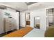 Bright and modern main bedroom with a large dresser and a view into the bathroom at 480 John Wesley Dobbs Ne Ave # 716, Atlanta, GA 30312