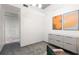 Spacious office with a stylish cabinet, a plush chair, and modern abstract art at 480 John Wesley Dobbs Ne Ave # 716, Atlanta, GA 30312