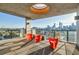 This patio has great views of the city skyline, unique seating, and a modern design at 480 John Wesley Dobbs Ne Ave # 716, Atlanta, GA 30312