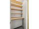 Custom shelving and concrete walls define this closet, providing stylish storage at 480 John Wesley Dobbs Ne Ave # 716, Atlanta, GA 30312