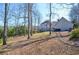 Large backyard with trees, offering plenty of space and privacy at 6450 Oak Valley Dr, Cumming, GA 30040