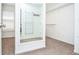 Walk-in closet featuring multiple shelves and clothing racks with window to outside at 6450 Oak Valley Dr, Cumming, GA 30040