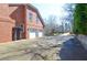 Long driveway leads to attached 3 car garage on this large brick home at 6450 Oak Valley Dr, Cumming, GA 30040