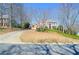 Charming two-story brick home featuring a well-manicured front yard and a welcoming entrance at 6450 Oak Valley Dr, Cumming, GA 30040