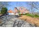 Beautiful two-story brick home with a three-car garage and well-maintained landscaping at 6450 Oak Valley Dr, Cumming, GA 30040