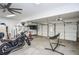 Spacious garage featuring ample storage, motorcycle, hanging tools and an entertainment area at 6450 Oak Valley Dr, Cumming, GA 30040