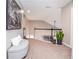 Hallway featuring carpet, plants and a cushioned bench with painting hanging on wall at 6450 Oak Valley Dr, Cumming, GA 30040